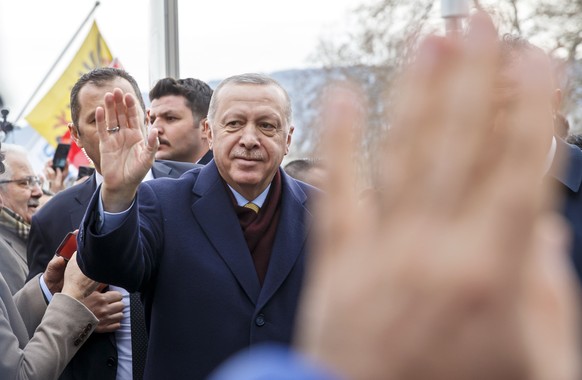 Turkey&#039;s President Recep Tayyip Erdogan greats people when arriving at his hotel one day before the opening UNHCR - Global Refugee Forum in Geneva, Switzerland, Monday, Dec. 16, 2019. (Salvatore  ...
