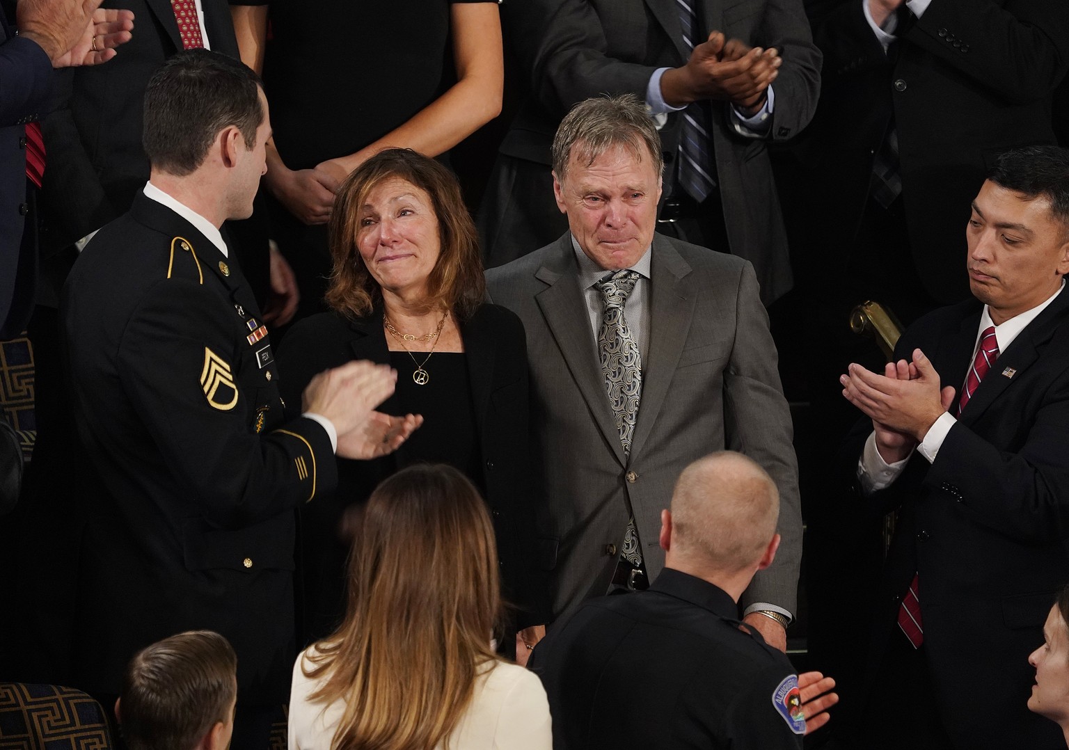 epa06486993 Fred (R) and Cindy (L) Warmbier react as US President Donald J. Trump recognizes them while talking about their son Otto while delivering his first State of the Union from the floor of the ...