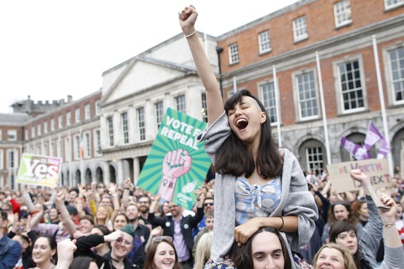 A woman from the&quot;Yes&quot; campaign reacts after the final result was announced in the Irish referendum on the 8th Amendment of the Irish Constitution at Dublin Castle, in Dublin, Ireland, Saturd ...