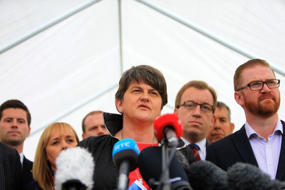 epa06063767 Leader of the Northern Ireland Democratic Unionist Party (DUP) Arlene Foster (C) with her negotiating team addresses the media in the grounds of Stormont Castle, Belfast, Northern Ireland  ...