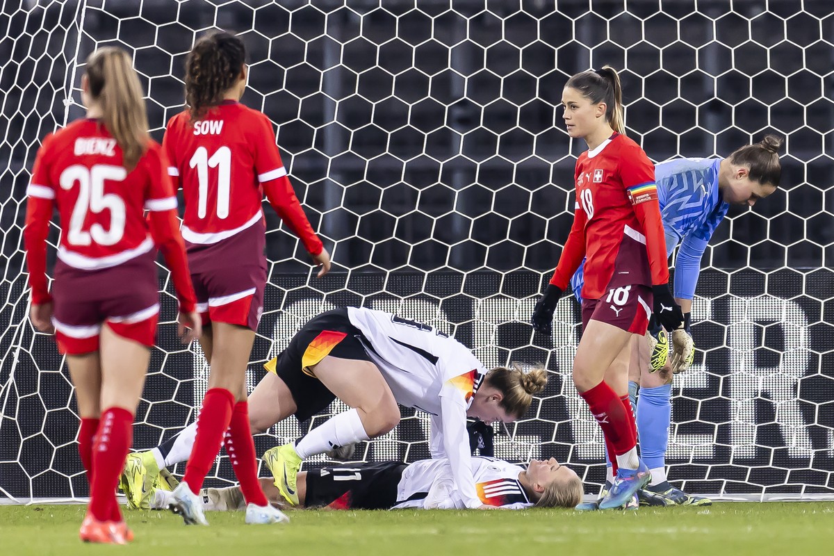 epa11748568 Germany's Lea Schueller (bottom) celebrates after scoring the 0-6 goal during a women's international friendly soccer match between Switzerland and Germany in Zurich, Switzerland ...