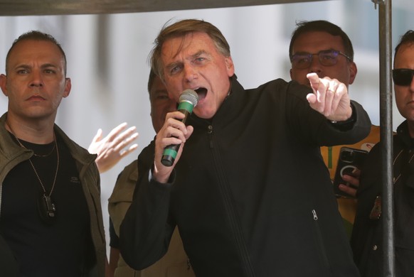 epaselect epa10124464 The president of Brazil, Jair Bolsonaro, speaks to his supporters during the president&#039;s first campaign event ahead of the presidential elections on 02 October, in Juiz de F ...