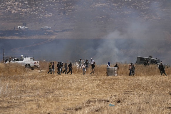 sraeli settlers set on fire agricultural lands on fire in the occupied West Bank town of Beit Furik, Thursday, July 13, 2026. (AP Photo/Majdi Mohammed)
Israel Palestinians