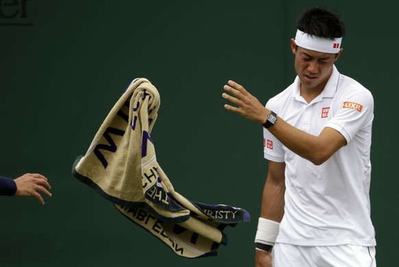 Japan&#039;s Kei Nishikori throws his towel during his Men&#039;s Singles Match against Italy&#039;s Marco Cecchinato on the opening day at the Wimbledon Tennis Championships in London Monday, July 3, ...