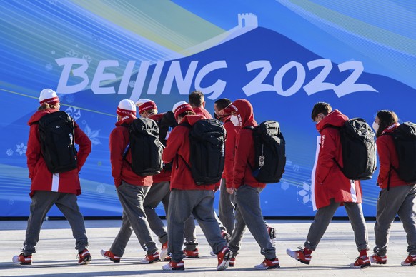 Members of Team Switzerland arrive at the Olympic Village ahead of the 2022 Winter Olympics, Tuesday, Feb. 1, 2022, in Beijing. (Anthony Wallace/Pool Photo via AP)