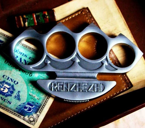 We only made a limited run of these detailed boxing iron knuckles. They are an exact replica of an early 1900&#039;s era weapon from my private collection. The finger holes are individually sized to f ...