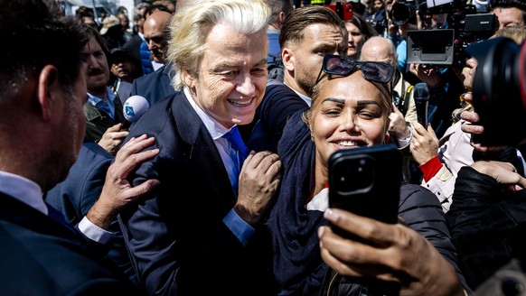epa11391717 Party for Freedom (PVV) leader Geert Wilders poses for photos with supporters during an election campaign on the Hague Market, Netherlands, 05 June 2024. The PVV leader is campaigning for  ...