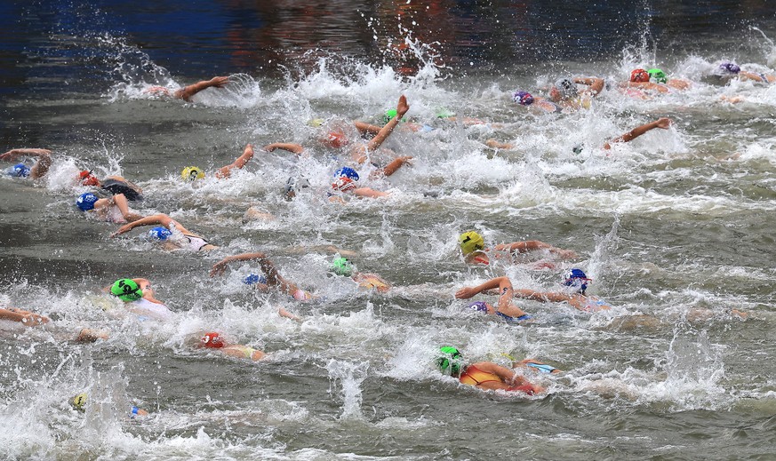 epa11510767 Athletes compete in the Swim section of the Women Individual race of the Triathlon competitions in the Paris 2024 Olympic Games, at the Pont Alexandre III in Paris, France, 31 July 2024. E ...