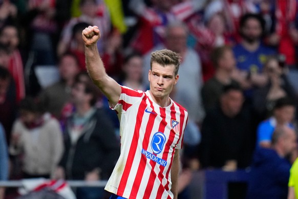 Atletico Madrid's Alexander Sorloth celebrates after scoring his side's fourth goal during the Champions League play-off second leg soccer match between Atletico Madrid and Club Brugge, in M ...