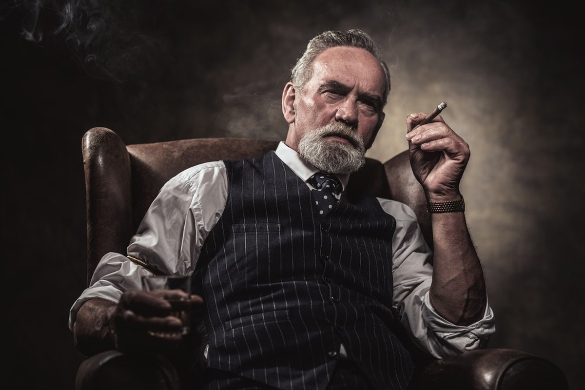 Man drinking whisky.