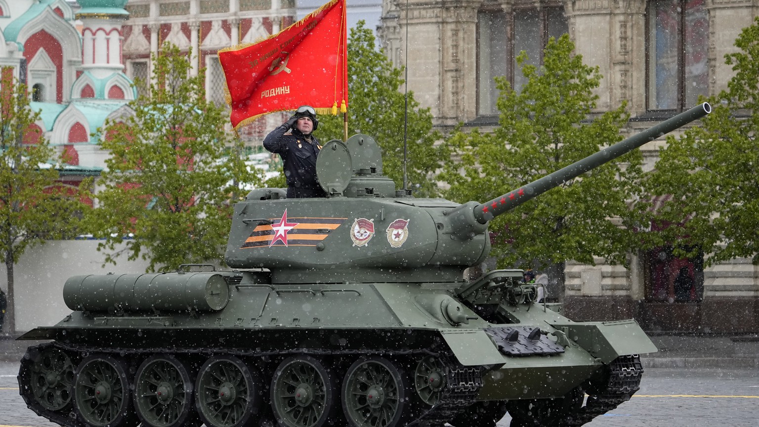 A legendary Soviet era T-34 tank with a red flag atop rolls during the Victory Day military parade in Moscow, Russia, Thursday, May 9, 2024, marking the 79th anniversary of the end of World War II. (A ...