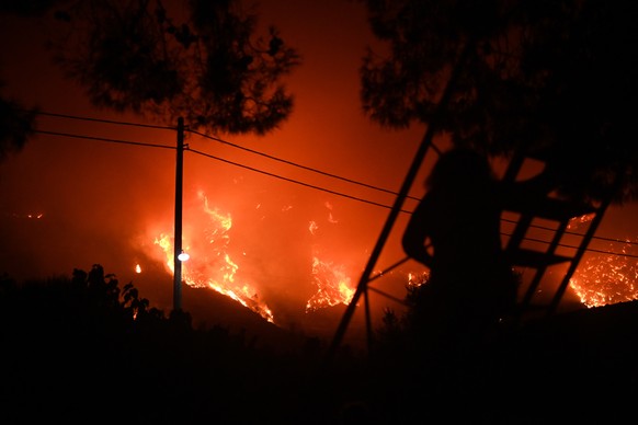 epa10765115 A wildfire burns at the Trapeza village, in Achaia Peloponnese, Greece, 23 July 2023. There is an extreme, category 5, fire risk high alert also for 24 July, for five Greek regions of Atti ...