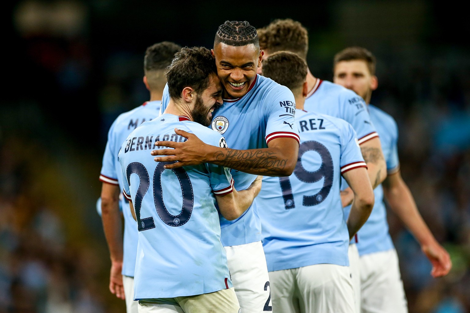 epa10635153 Bernardo Silva (L) and Manuel Akanji (C) of Manchester City celebrate the 4-0 goal during the UEFA Champions League semi-finals, 2nd leg soccer match between Manchester City and Real Madri ...