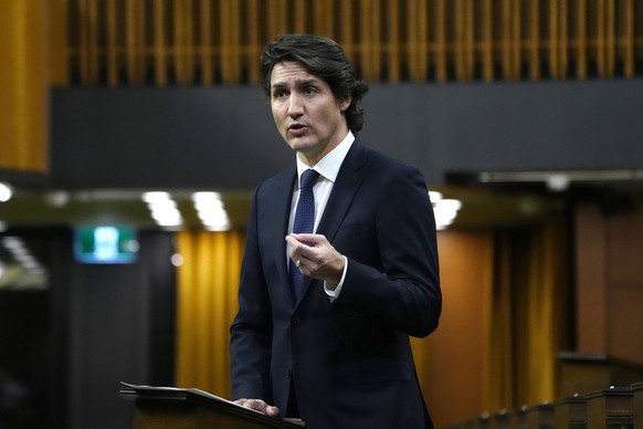 Canadian Prime Minister Justin Trudeau rises during an emergency debate in the House of Commons on the situation in Ottawa, as a protest against COVID-19 restrictions that has been marked by gridlock  ...