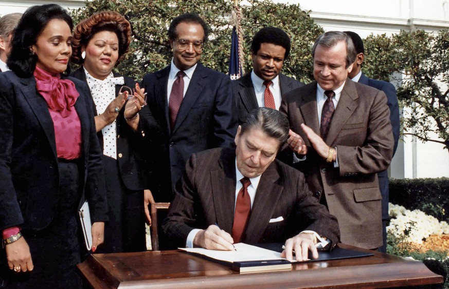 WASHINGTON (AFPN) -- Then-President Ronald Reagan signs the bill commemorating Martin Luther King Jr.&#039;s birthday as a national holiday on Nov. 2, 1983 in the White House rose garden. This year&#0 ...