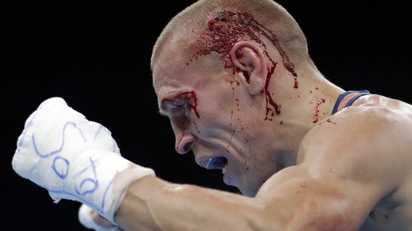 Russia&#039;s Vladimir Nikitin reacts as he won a men&#039;s bantamweight 56-kg quarterfinals boxing match against Ireland&#039;s Michael John Conlan at the 2016 Summer Olympics in Rio de Janeiro, Bra ...