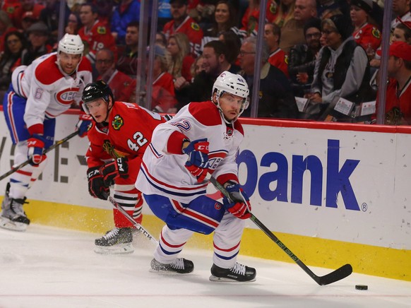 Nov 13, 2016; Chicago, IL, USA; Montreal Canadiens right wing Sven Andrighetto (42) being pursued by Chicago Blackhawks defenseman Gustav Forsling (42) during the third period at the United Center. Ch ...