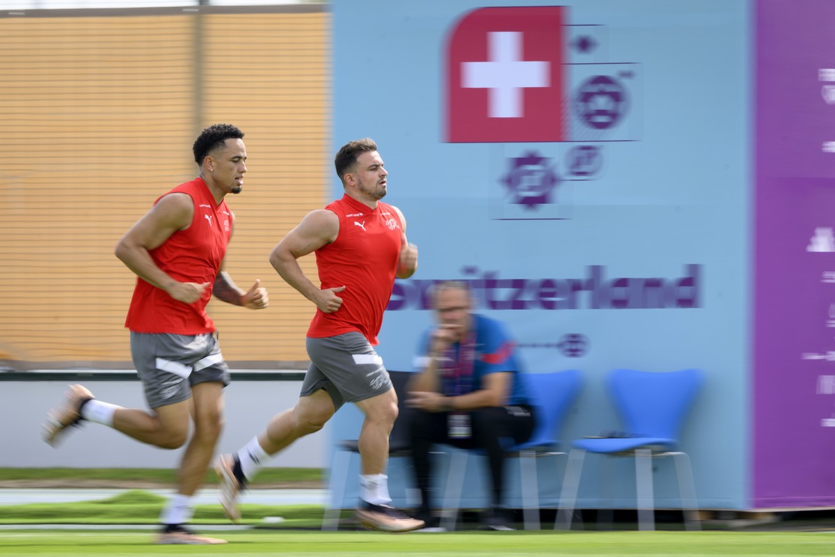 Switzerland's forward Noah Okafor, left, and Switzerland's midfielder Xherdan Shaqiri, right, attend a open training session of Swiss national soccer team in preparation for the FIFA World C ...