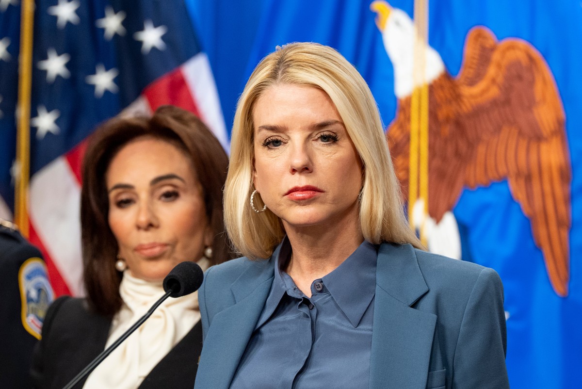 Attorney General Pam Bondi, with U.S. Attorney Jeanine Pirro behind, pauses while speaking during a news conference at the Department of Justice, Thursday, Dec. 4, 2025, in Washington. (AP Photo/Alex  ...