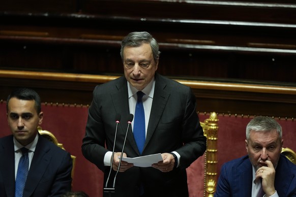 Italian Premier Mario Draghi, center, flanked by Foreign Minister Luigi Di Maio, left, and Defense Minister Lorenzo Guerini, delivers his speech at the Senate in Rome, Wednesday, July 20, 2022. Draghi ...