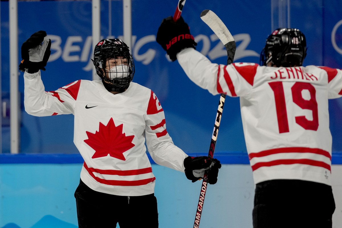 Canada's Sarah Nurse (20) celebrates with Brianne Jenner (19) after scoring a goal against Russian Olympic Committee during a preliminary round women's hockey game at the 2022 Winter Olympic ...