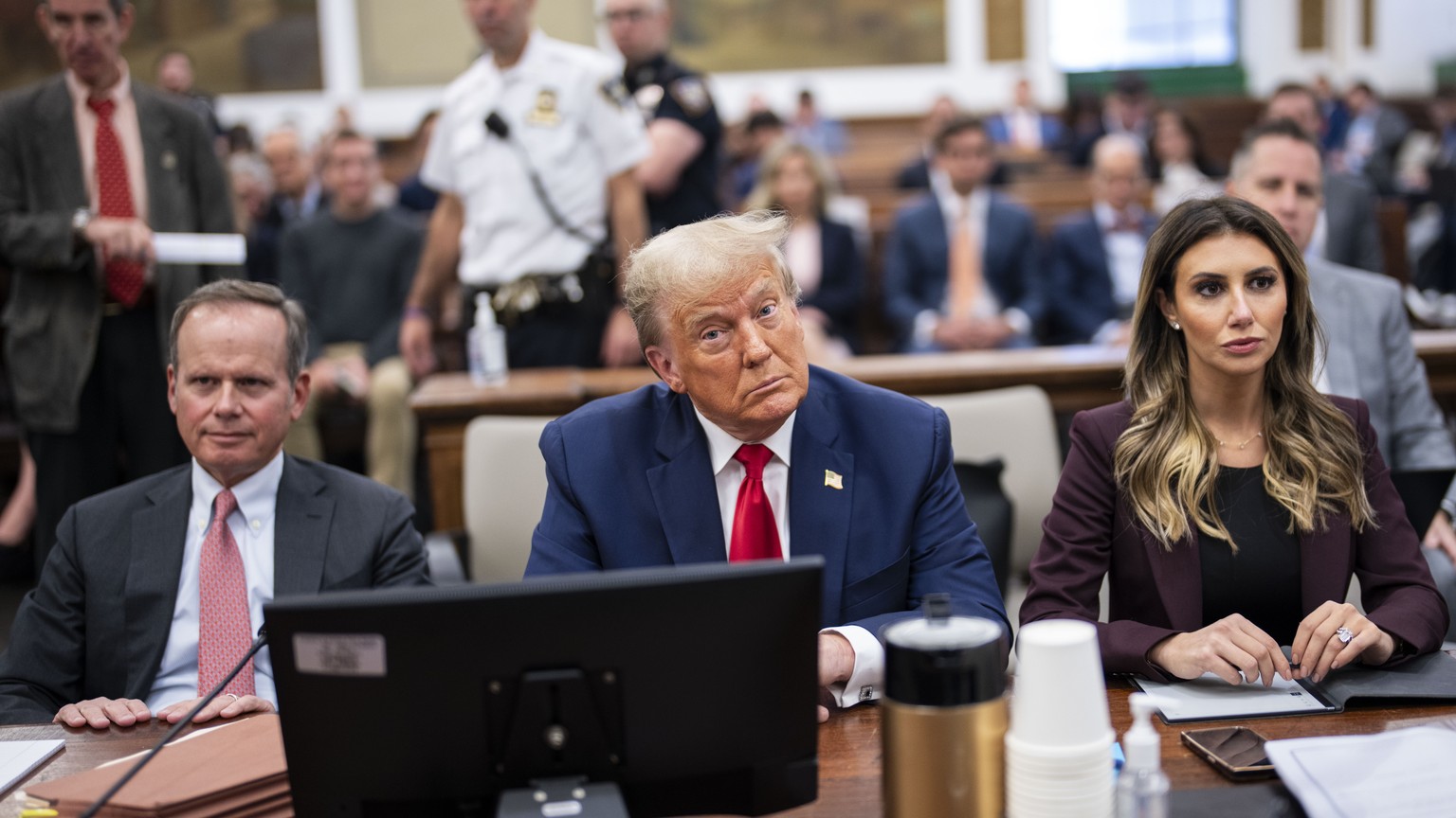 epa10923851 Former US President Donald J. Trump (C) with his attorneys Alina Habba (R) and Christopher Kise (L) sits in the courtroom as he attends the third week of his civil fraud trial in New York, ...