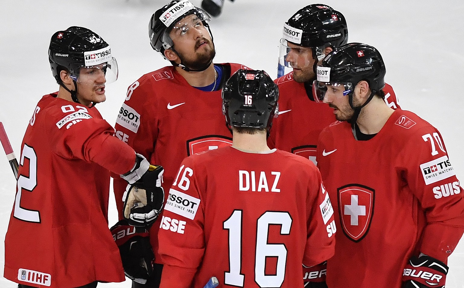 Switzerland’s Gaetan Haas, Vincent Praplan, Raphael Diaz, Philippe Furrer and Denis Hollenstein, from left, speak during their Ice Hockey World Championship group B preliminary round match between Swi ...