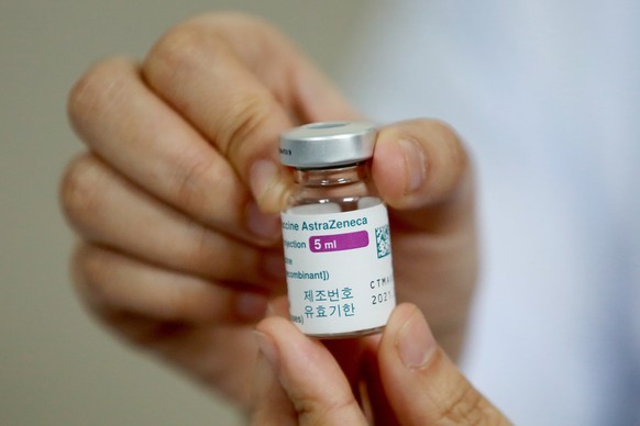 epa09063119 A medical worker holds a vial of the AstraZeneca COVID-19 vaccine at Thanh Nhan hospital in Hanoi, Vietnam, 09 March 2021. Vietnam launched its COVID-19 vaccination campaign on 08 March, a ...