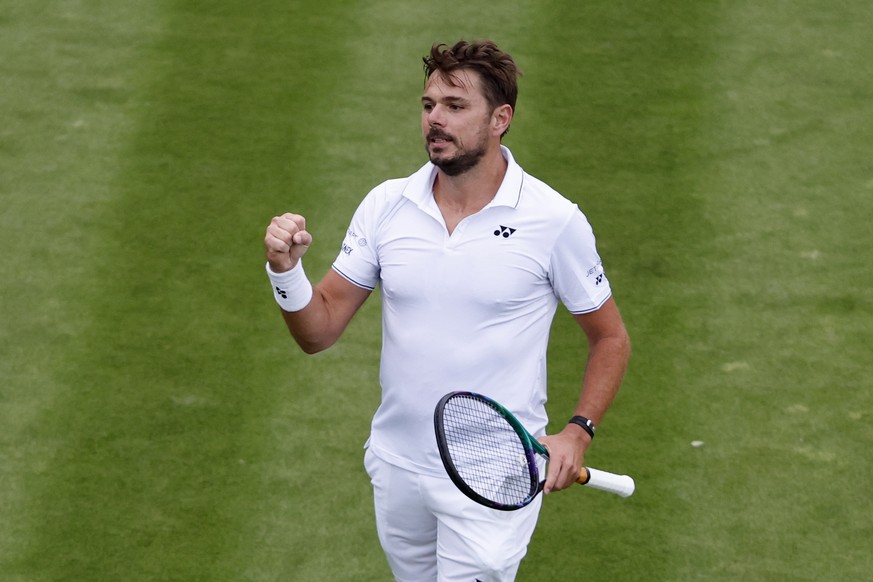 Stan Wawrinka of Switzerland celebrates after winning his first round match against Emil Ruusuvuori of Finland at the All England Lawn Tennis Championships in Wimbledon, London, Monday, July 3, 2023.  ...