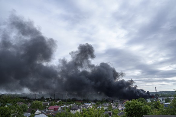 Smoke rises after a Russian attack in Kharkiv, Ukraine, Friday, May 17, 2024. (AP Photo/Evgeniy Maloletka)
