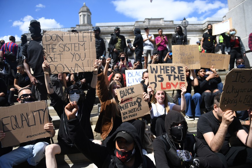 epa08482830 A Black Lives Matter protest in Trafalgar square during a Black lives matter demonstration in London, Britain, 13 June 2020. Protesters gathered to express their feelings in regard to the  ...