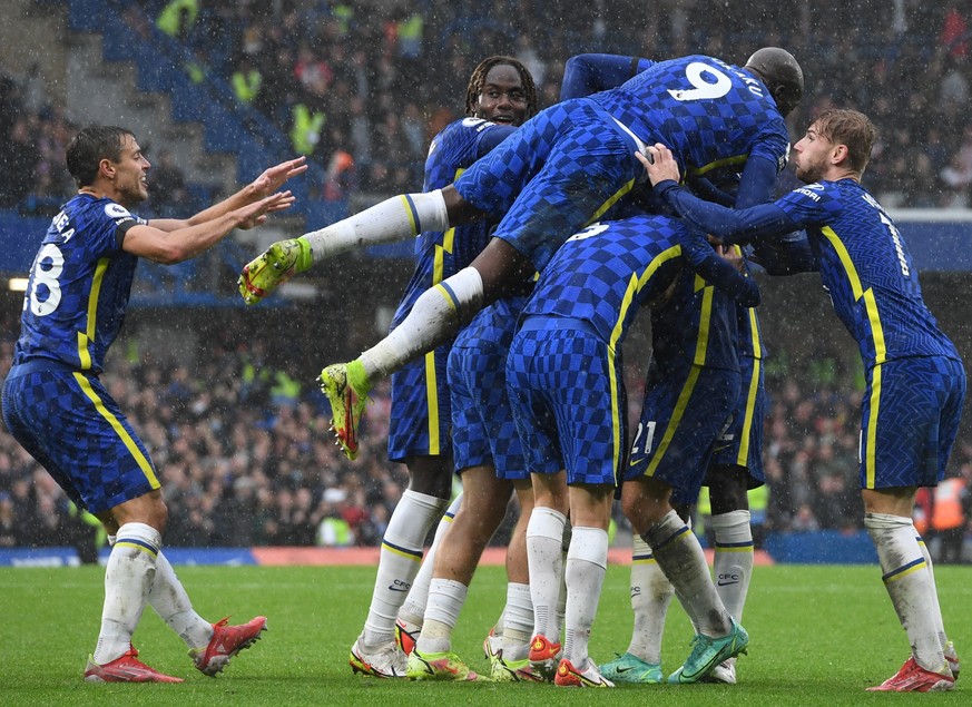 epa09502092 Chelsea's Ben Chilwell (hidden) celebrates with teammates after scoring the 3-1 goal during the English Premier League soccer match between Chelsea FC and Southampton FC in London, Britain ...