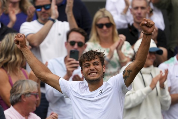 Flavio Cobolli of Italy celebrates winning his men&#039;s singles fourth round match against Marin Cilic of Croatia at the Wimbledon Tennis Championships in London, Monday, July 7, 2025.(AP Photo/Joan ...