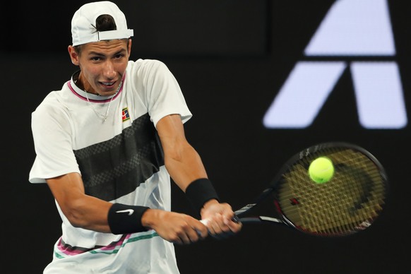 epa07291912 Alexei Popyrin of Australia in action against Dominic Thiem of Austria during their second round match on day four of the Australian Open tennis tournament in Melbourne, Australia, 17 Janu ...