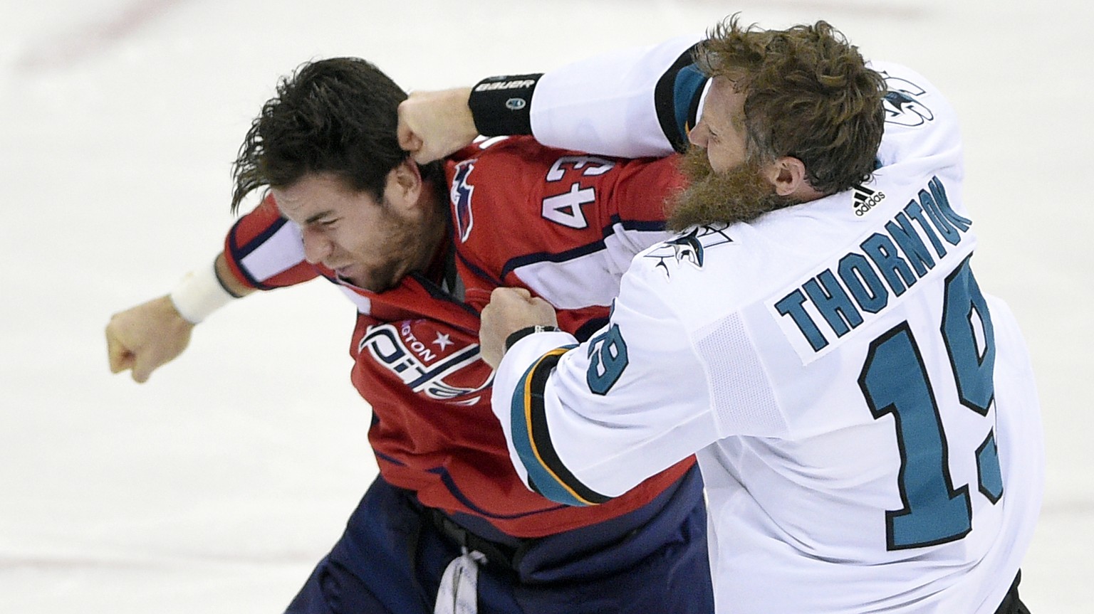 San Jose Sharks center Joe Thornton (19) fights Washington Capitals right wing Tom Wilson (43) during the third period of an NHL hockey game, Monday, Dec. 4, 2017, in Washington. (AP Photo/Nick Wass)