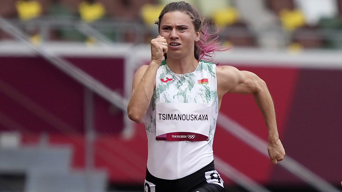 Krystsina Tsimanouskaya, of Belarus, runs in the women's 100-meter run at the 2020 Summer Olympics, Friday, July 30, 2021. Tsimanouskaya alleged her Olympic team tried to remove her from Japan in ...