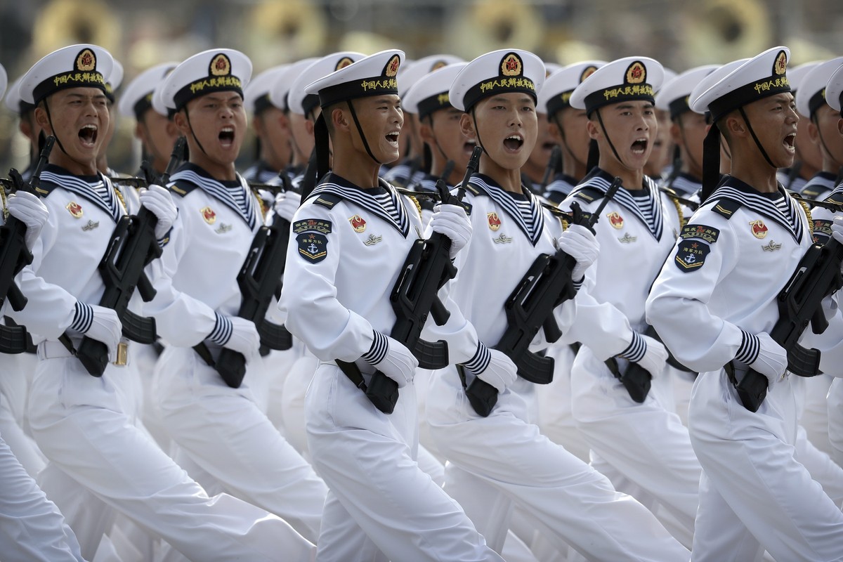 FILE - Soldiers from China's People's Liberation Army (PLA) Navy march in formation during a parade to commemorate the 70th anniversary of the founding of Communist China in Beijing, Oct. 1, ...