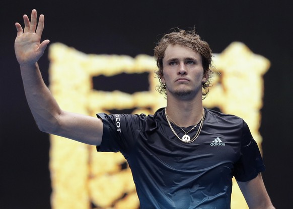 Germany&#039;s Alexander Zverev waves after winning his first round match against Slovenia&#039;s Aljaz Bedene, left, at the Australian Open tennis championships in Melbourne, Australia, Tuesday, Jan. ...