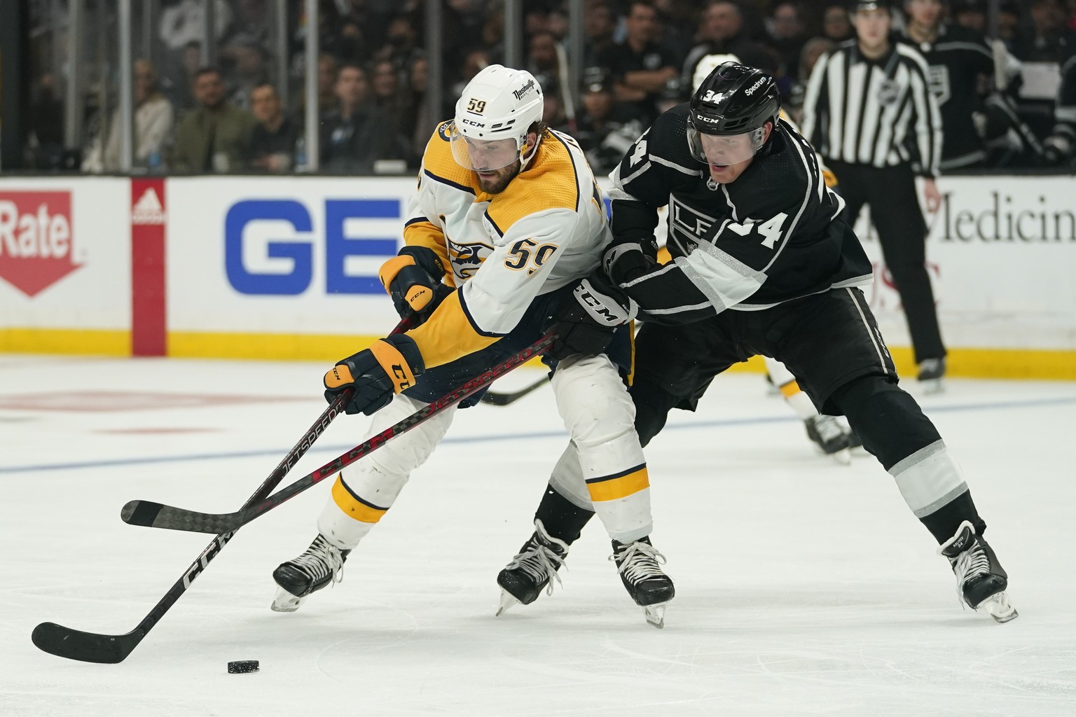 Nashville Predators defenseman Roman Josi (59) and Los Angeles Kings right wing Arthur Kaliyev (34) battle for the puck during the third period of an NHL hockey game Tuesday, March 22, 2022, in Los An ...