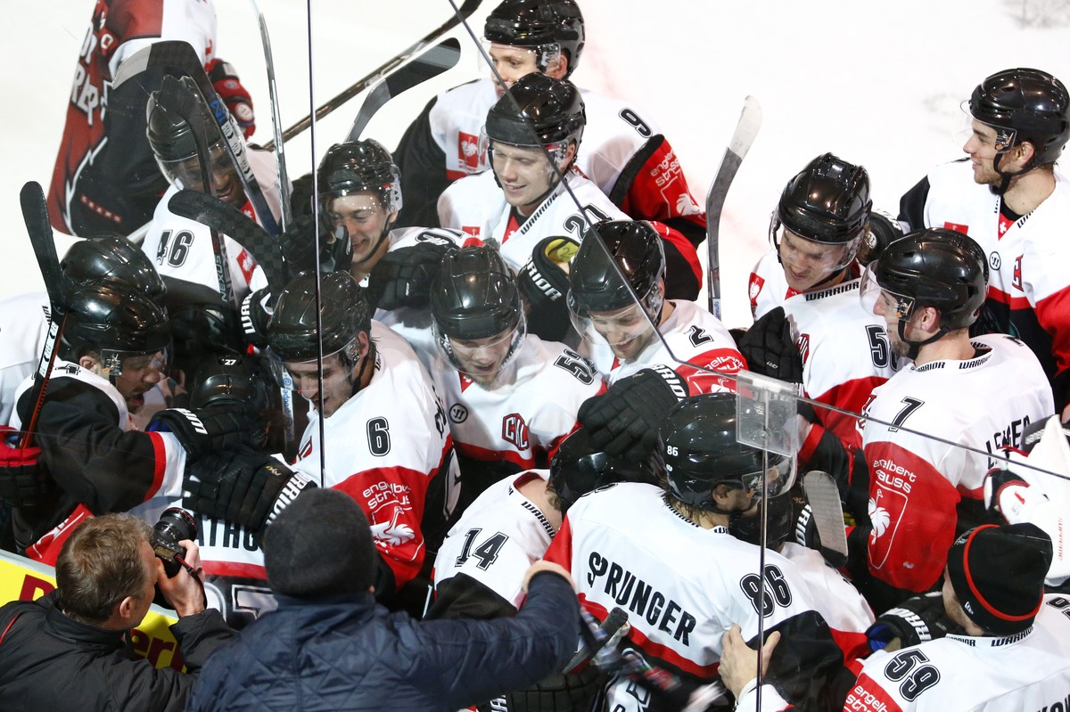 Fribourg's Yannick Rathgeb (center, hidden) celebrates his winning goal with team mates during the ice hockey Champions League match 1/8 Final between HC Fribourg-Gotteron and KalPa Kuopio of Fin ...