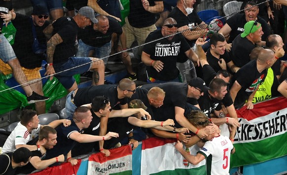 epa09296799 Attila Fiola of Hungary celebrates with fans after Hungary scored the opening goal during the UEFA EURO 2020 group F preliminary round soccer match between Germany and Hungary in Munich, G ...