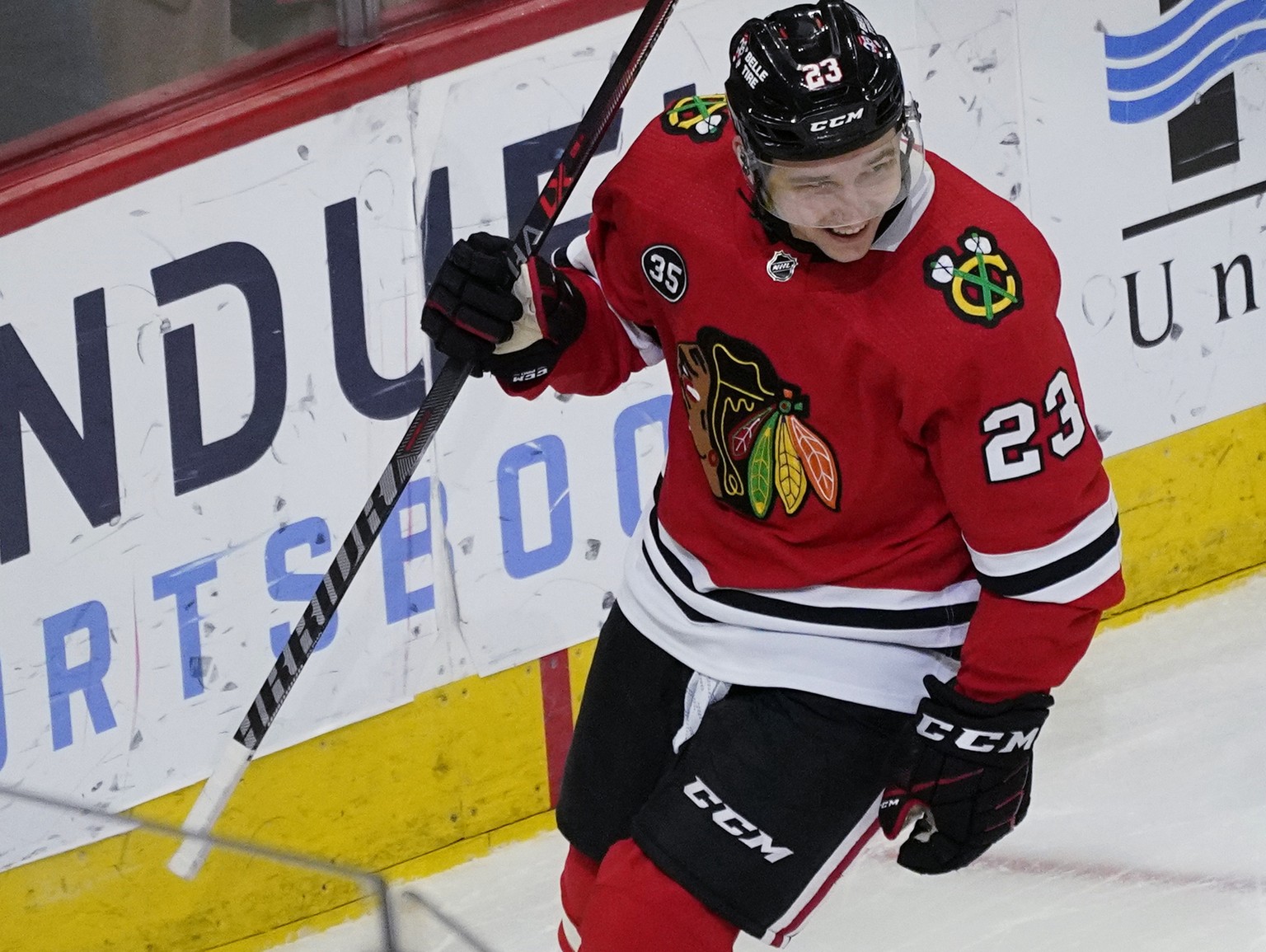 Chicago Blackhawks center Philipp Kurashev smiles after scoring a goal against the Dallas Stars during the first period of an NHL hockey game in Chicago, Sunday, April, 10, 2022. (AP Photo/Nam Y. Huh) ...