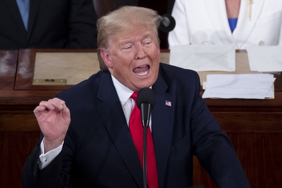 epa08193837 US President Donald J. Trump (R) delivers his State of the Union address in the US House of Representatives on Capitol Hill in Washington, DC, USA, 04 February 2020. President Trump delive ...