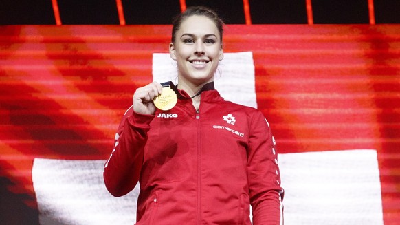 epa09156677 epa09156655 Gold medalist Switzerland&#039;s Giulia Steingruber celebrates on the podium after performing on the vault during the women&#039;s apparatus finals of the 2021 European Artisti ...