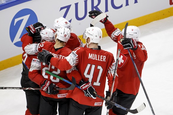 Switzerland&#039;s forward Joel Vermin, left, celebrates his goal with teammates forward Nino Niederreiter #22, forward Timo Meier #28, defender Mirco Mueller #41 and defender Raphael Diaz, right, aft ...