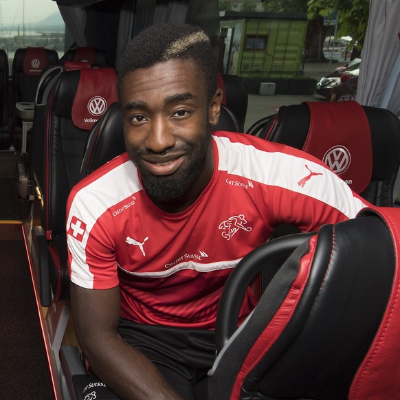 Swiss goalkeeper Yann Sommer, left, and Swiss defender Johan Djourou, right, pose inside the new bus of the Swiss soccer national team, in Neuchatel, Switzerland, Tuesday, May 30, 2017. Switzerland wi ...