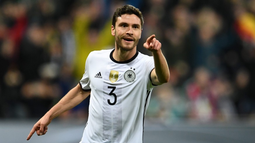 epa05235281 Jonas Hector of Germany (L) celebrates scoring the 3-0 during the international soccer match between Germany and Italy, at the Allianz Arena in Munich, Germany, 29 March 2016. EPA/Andreas  ...