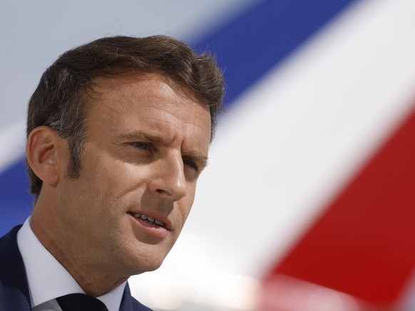 French President Emmanuel Macron delivers a statement on the tarmac in front of his presidential plane before his departure to visit French NATO troops stationed in Romania, at Paris-Orly airport in O ...