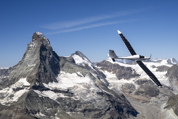 epa12245110 SolarStratos, a solar powered aircraft prototype, flown by Swiss adventurer Raphael Domjan flies by the iconic Matterhorn mountain during a scouting and test flight near the alpine village ...