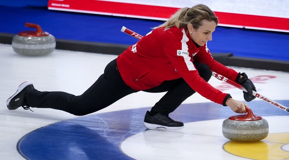 Switzerland skip Silvana Tirinzoni makes a shot against Russia at the Women's World Curling Championship in Calgary, Alberta, Thursday, May 6, 2021. Jeff McIntosh/The Canadian Press via AP)